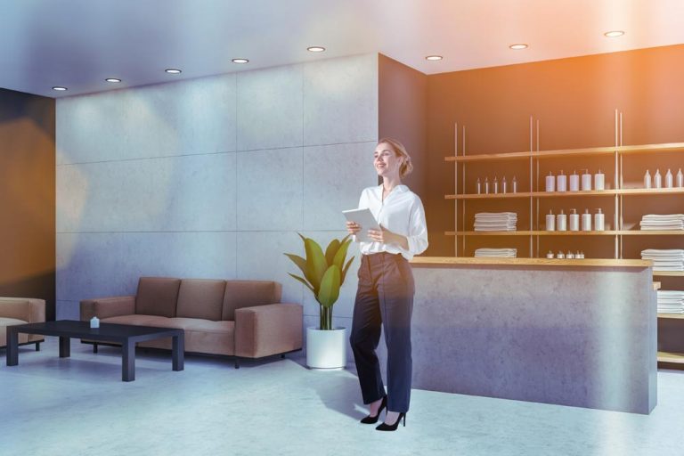 Spa and salon owner using digital tools to manage bookings, client data, and business risks in 2026